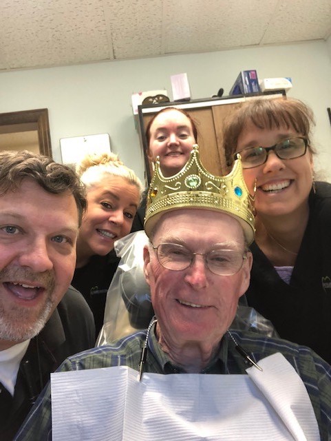 A happy patient with the team in a selfie at Baccellieri Family Dentistry. 